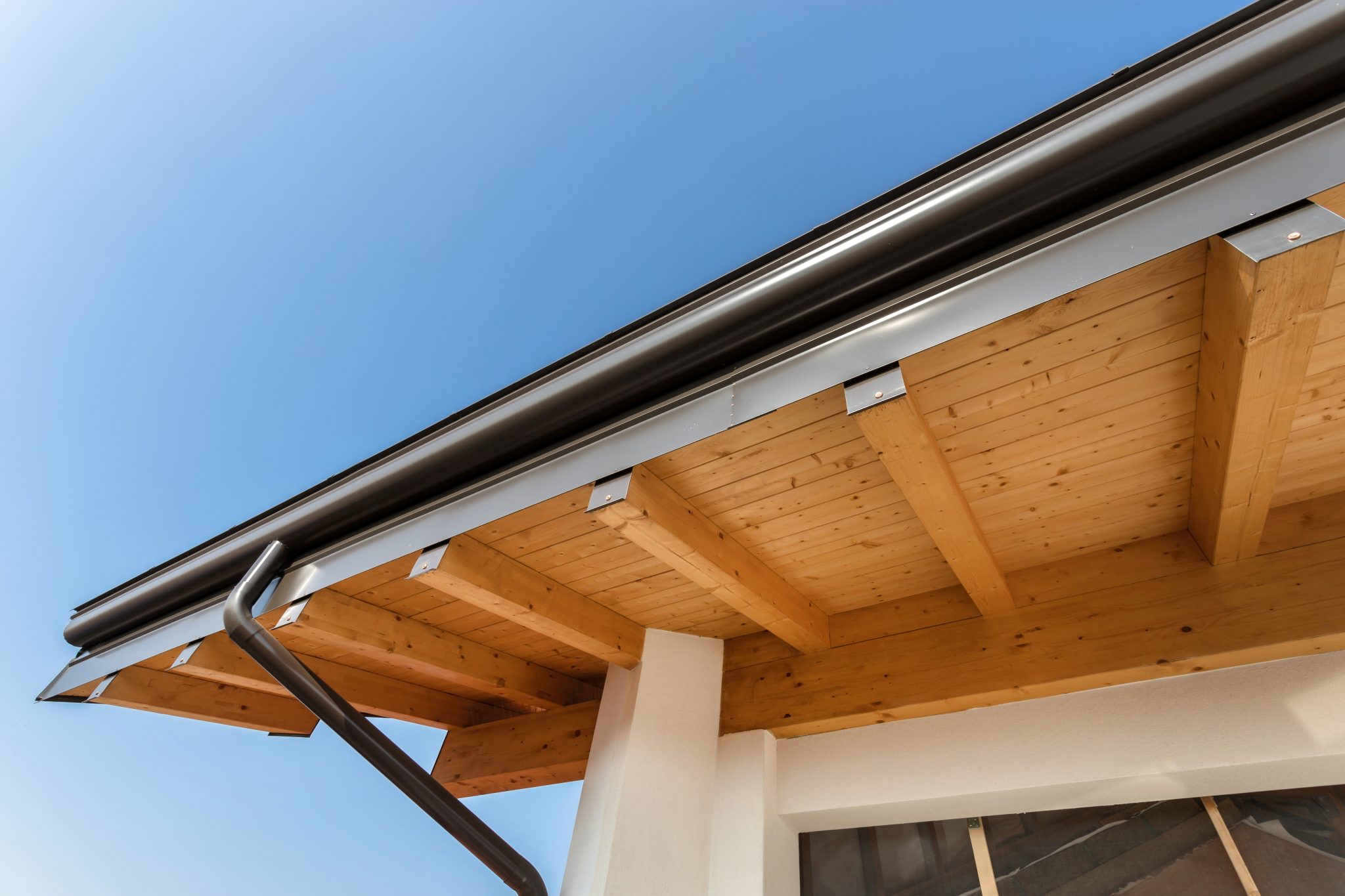 Clean gutters on a Hobart home against a clear sky